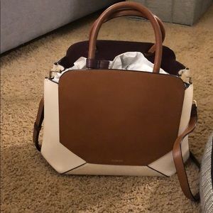 Auxiliary (Aristide) tan bega crossbody purse